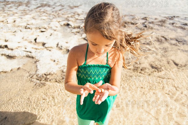 Girl (6-7) playing on beach