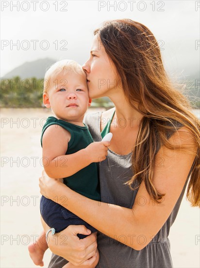 Young mother with baby daughter (6-11 months)