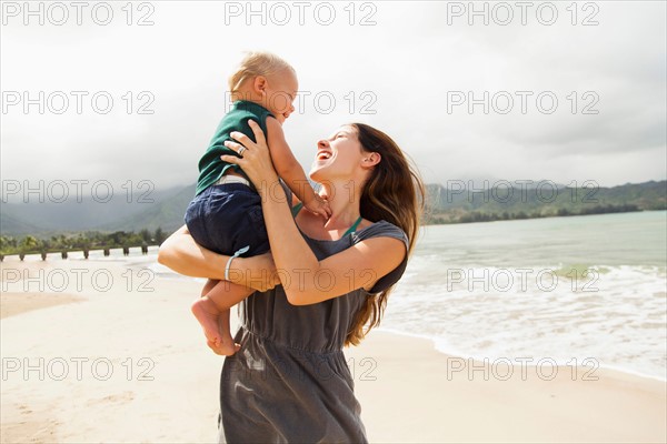 Young mother with baby daughter (6-11 months)