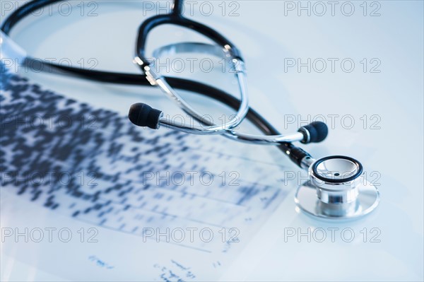 Studio shot of stethoscope with dna test.