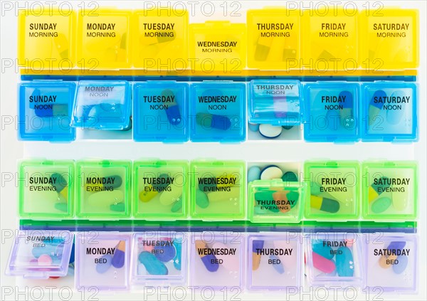 Studio shot of colorful pill containers.