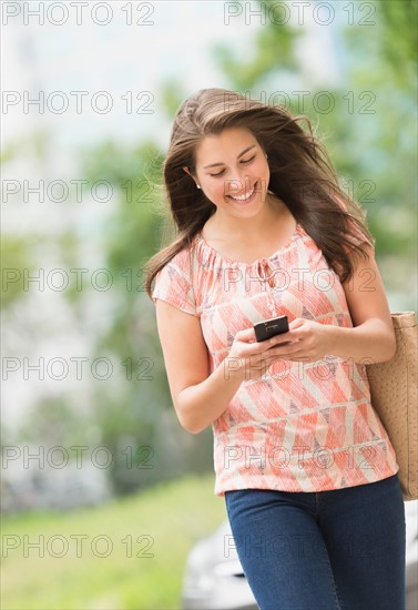 Woman texting on phone.