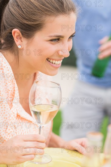 Woman drinking white wine.