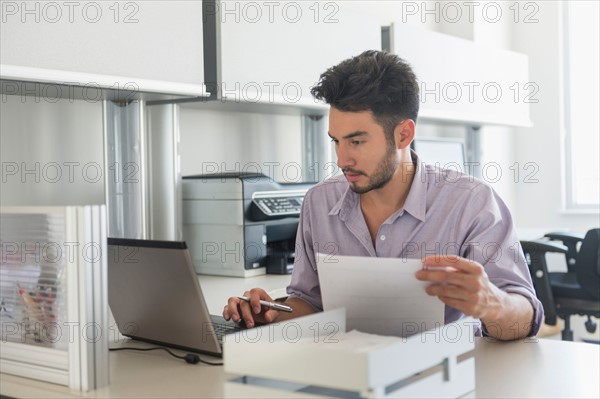 Businessman at work in office.