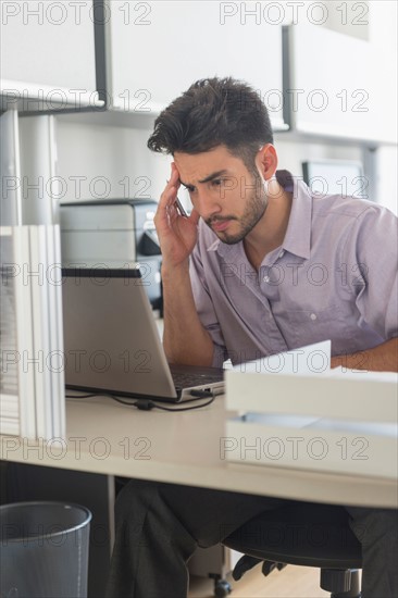 Businessman at work in office.