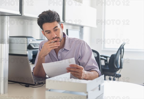 Businessman at work in office.