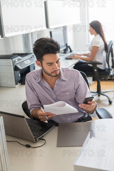 Businessman at work in office.