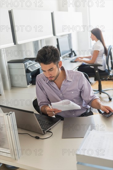 Businessman at work in office.