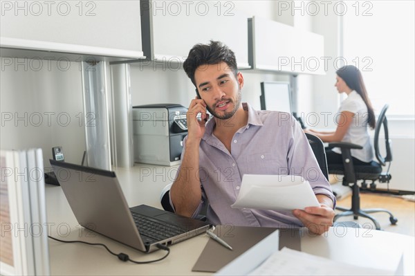 Businessman at work in office.