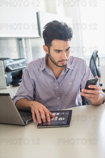 Man using technology in office.