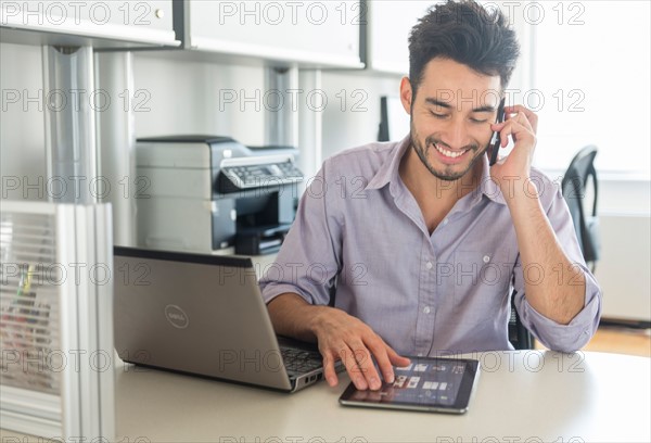 Man using technology in office.