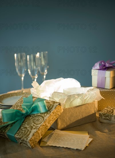 Open gift box and on table.