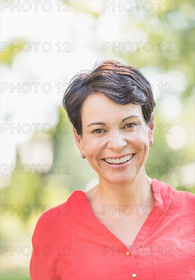 Portrait of happy mature woman smiling.