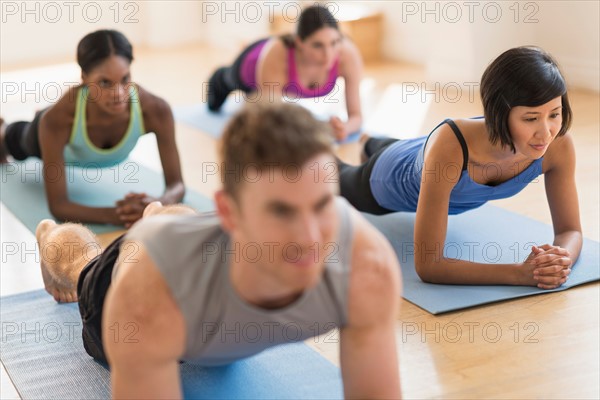 People training in gym.