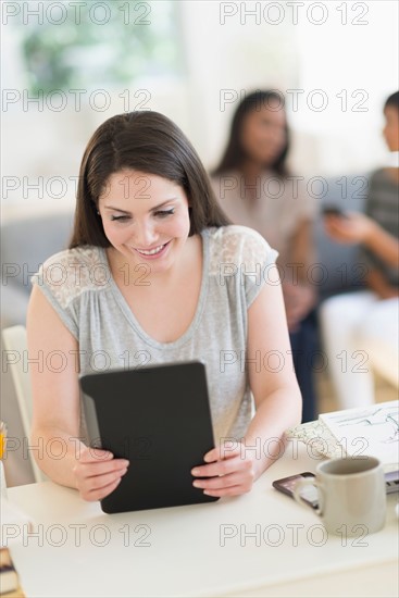 Woman using digital tablet.