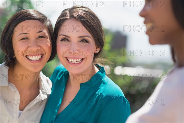 Women laughing outside.