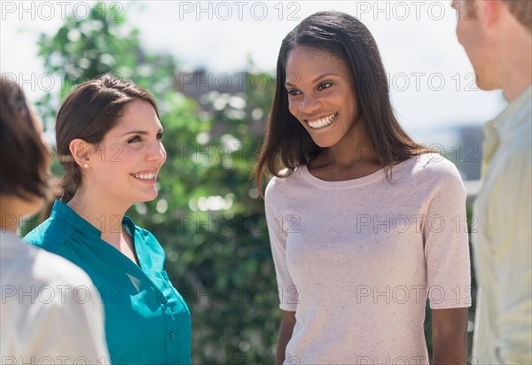 Friends laughing outside.