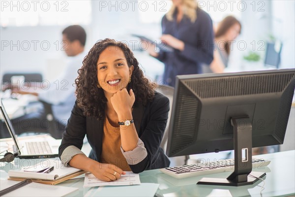 Woman smiling in office.