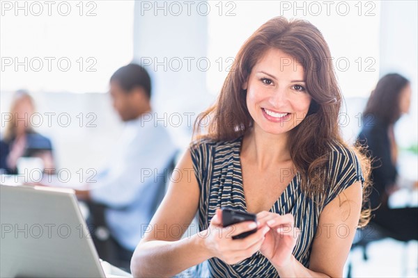 Smiling woman in office.