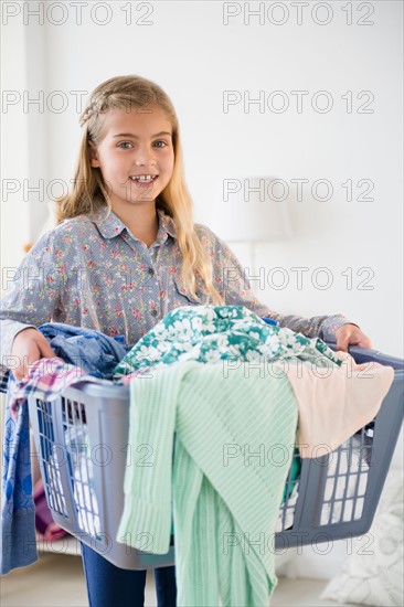 Girl (8-9) carrying laundry