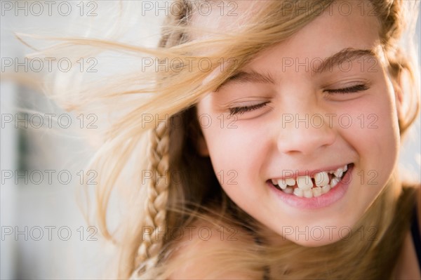 Portrait of smiling blonde girl (8-9)