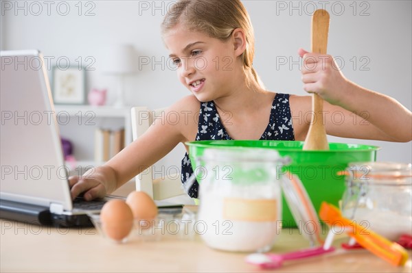 View of girl (8-9) baking