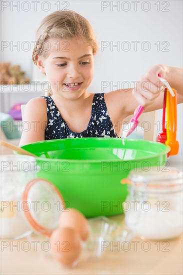 View of girl (8-9) baking