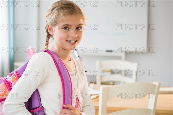 Portrait of girl (8-9) in classroom