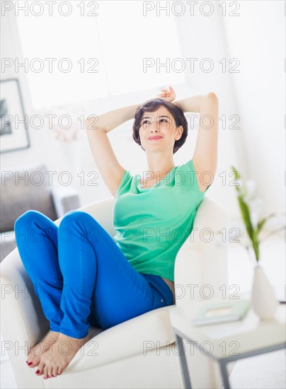 Portrait of young woman relaxing at home