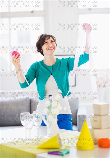 Woman decorating room for party