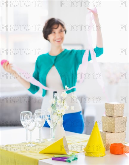 Woman decorating room for party