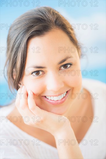 Studio Shot of smiling woman with brown hair