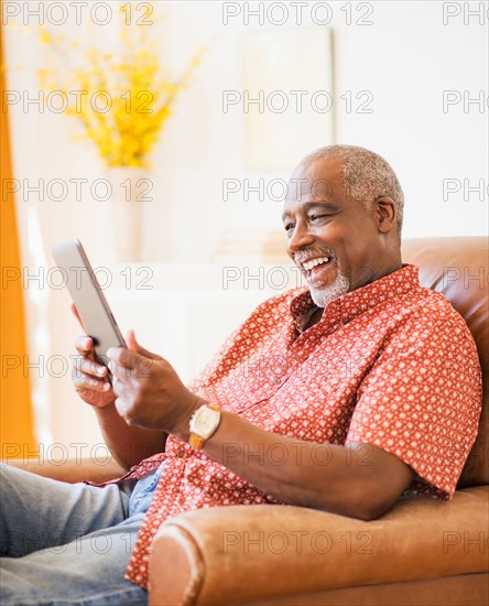 Portrait of men using digital tablet