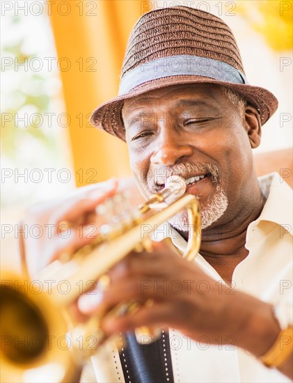 Portrait of man playing trumpet