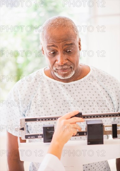 Shocked man on weight scale