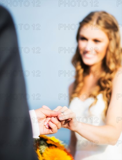 Bride and groom holding hands