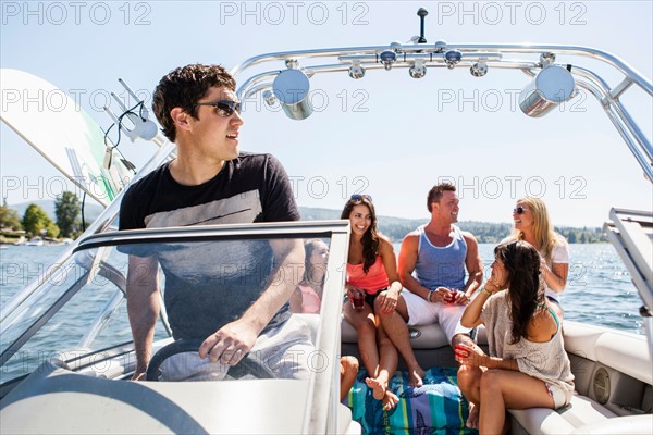 Young people enjoying speedboat ride