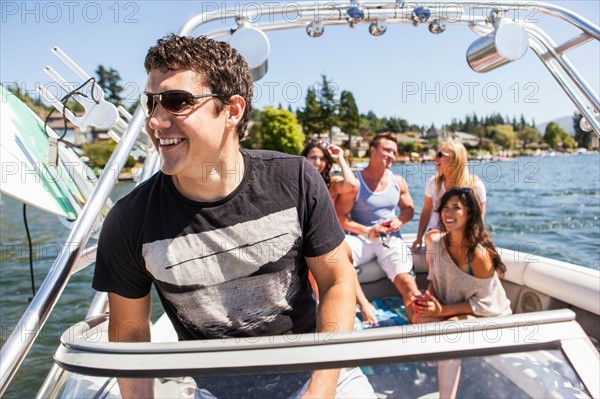 Young people enjoying speedboat ride