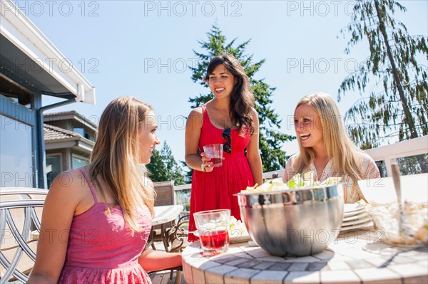 Young women enjoying outdoor meal