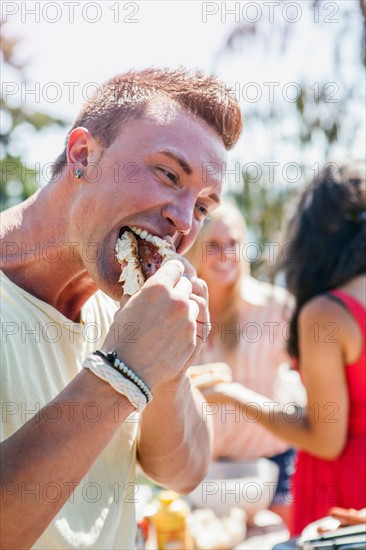 Young people enjoying barbecue