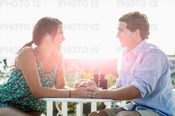 Side view of young man and woman looking at each other