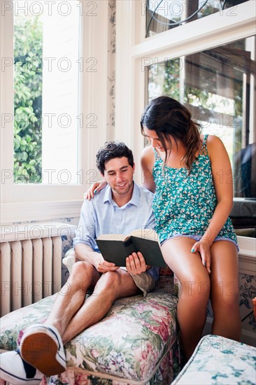 Couple relaxing at sun porch