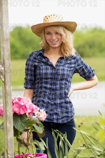 Portrait of young woman in garden