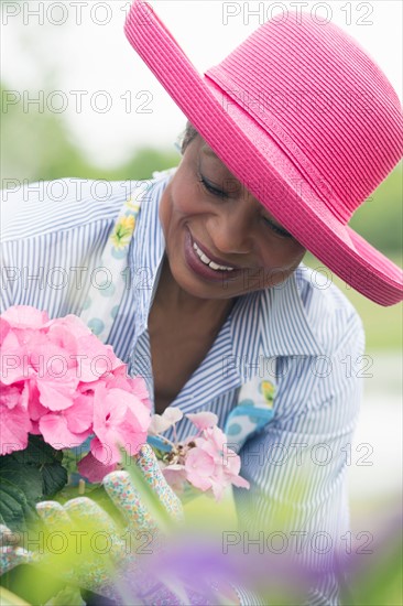 Portrait of senior woman working in garden