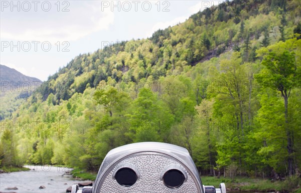 Coin operated binocular facing green hill