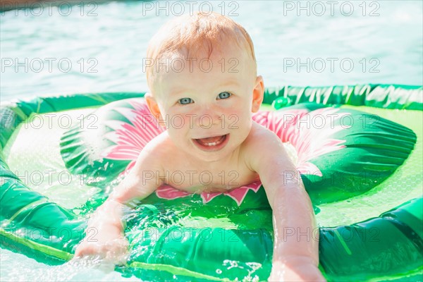 Baby Boy (18-23 months) playing in swimming pool