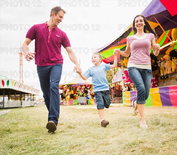 Happy Family and son (4-5) in amusement park