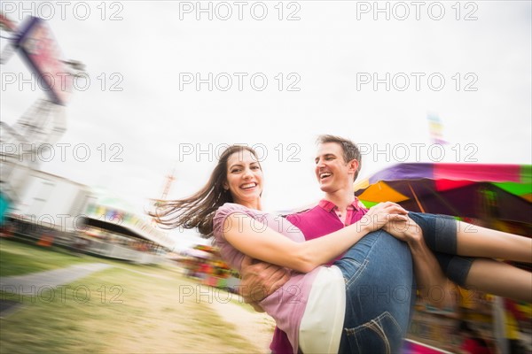 Couple in amusement park