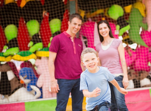 Happy Family and son (4-5) having fun in amusement park