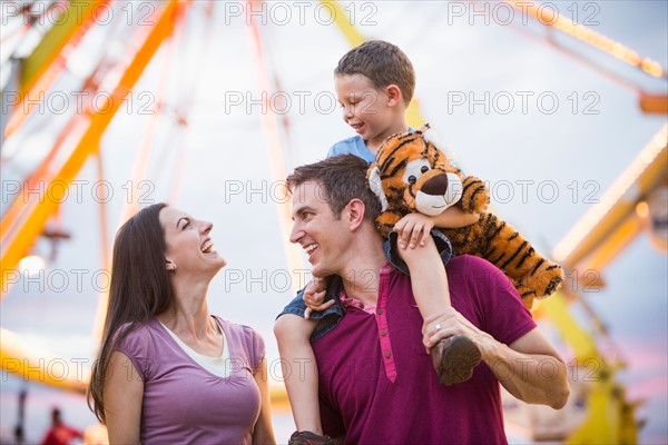 Happy Family with son (4-5) in amusement park